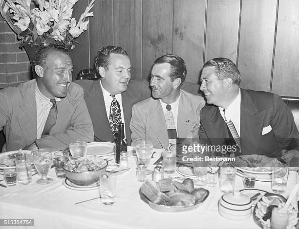 New York, NY- Lloyd Mangrum, new U.S. Open golf champ, celebrates his victory on the links with a few friends at Toots Shor's. Pictured are: Victor...