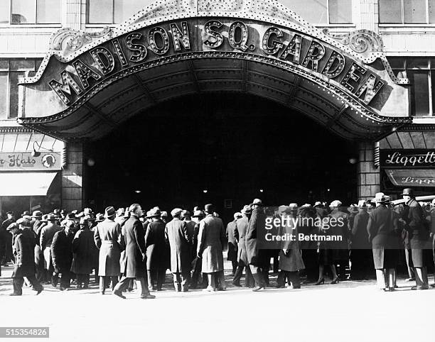 New York, NY: A crowd gathers outside the entrance to Madison Square Garden. Undated photograph.