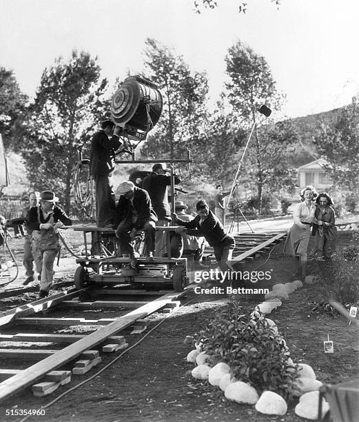 Hollywood, CA- Bette Davis and Geraldine Fitzgerald walk a dramatic "last mile" while the mobile camera follows their progress for a scene in the...