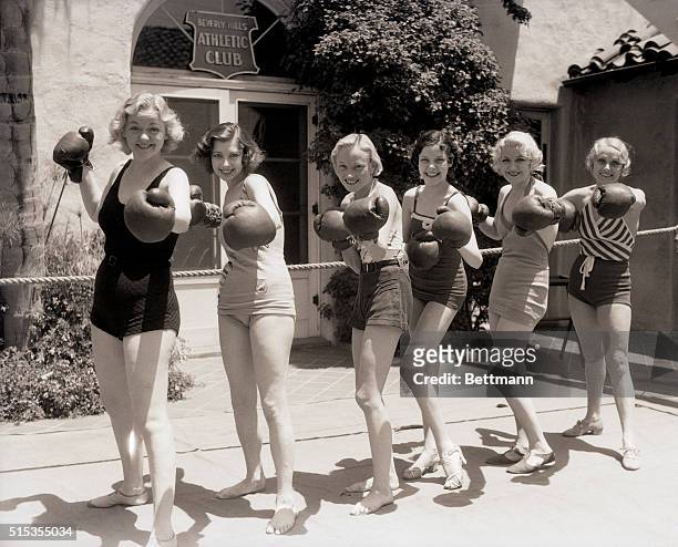 Beverly Hills, CA- Knockouts everyone are these pretty members of the "Nine O'Clock Revue", who line up in battle formation during a workout at the...
