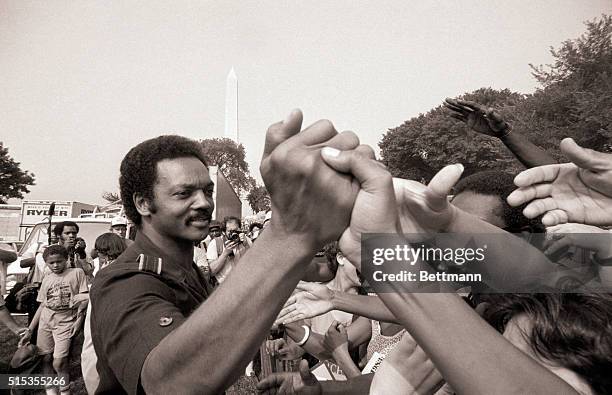 Rev. Jesse Jackson shakes hands at the 20th anniversary commemoration of the Martin Luther King, Jr.'s Freedom March, also known as the "March on...