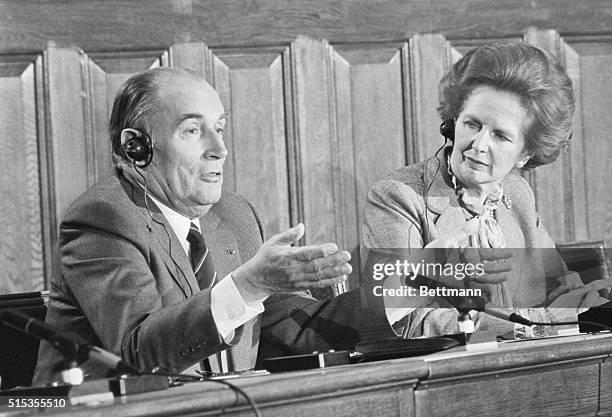 French President Francois Mitterrand answers questions at a press conference with British Prime Minister Margaret Thatcher.