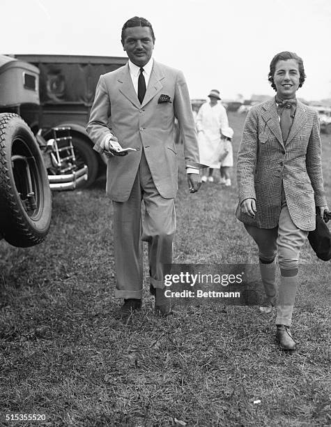 Westhampton, NY: Picture shows Mr. And Mrs. J.V. Bouvier 3d at the Westhampton Horse Show. She is wearing her riding outfit and he is in a suit.