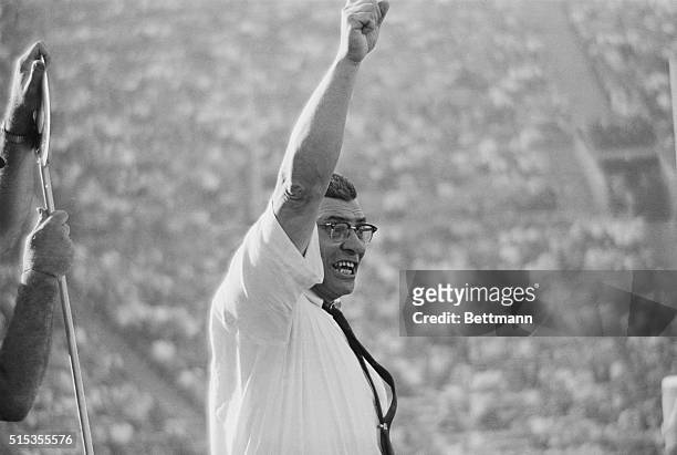 Winning coach Vince Lombardi of the Green Bay Packers roars encouragement to his team as they score their fourth period touchdown and come close to...