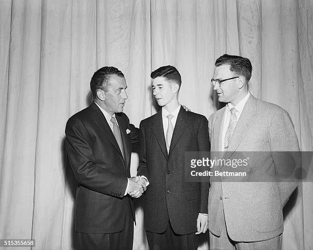 Fourteen year old William Cashore of Norristown, Pennsylvania, who won the 1954 National Spelling Contest, gets congratulated by television...