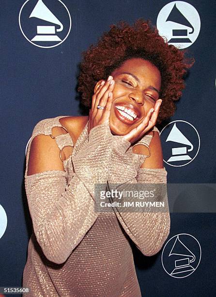 Macy Gray celebrates after she received a nomination for best new artist for the 42nd annual Grammy Awards 04 January in Los Angeles. Winners are to...