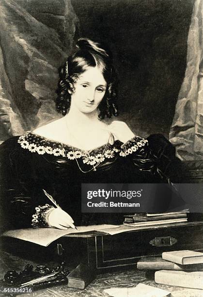 Author Mary Shelley writing at her desk.