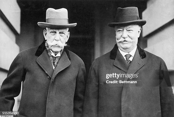 United States Supreme Court Associate Justice Oliver Wendell Holmes stands with Chief Justice, and former president, William Howard Taft outside.