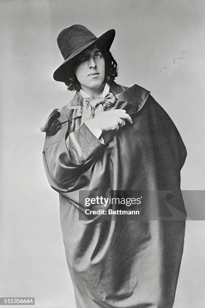 Oscar Wilde , the Irish poet, wit and dramatist, is shown at the time of his arrival in America in 1882.