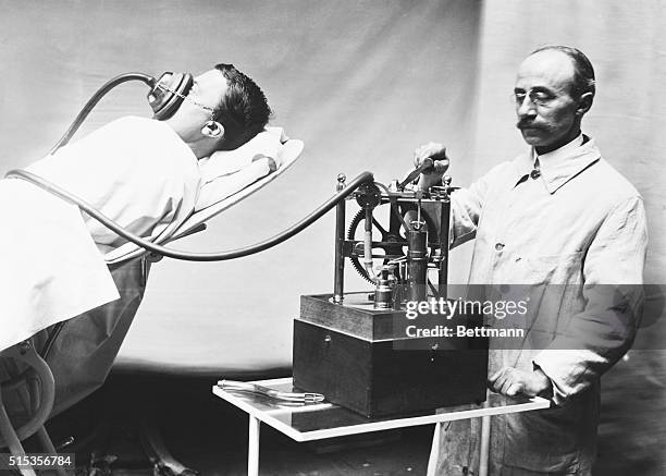 Early chloroform narcosis. The Dubois inhaler worked by crank.
