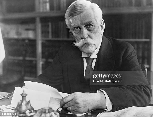 Photo shows Oliver Wendell Holmes , Associate Justice of the Supreme Court, at his desk. Photograph, ca. 1910s-1920s.