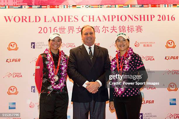 Kuo Ai-Chen of Chinese Taipei and Lin Tzu-Chi of Chinese Taipei receive the medal for third team from the hands of Iain Roberts during the Prize...