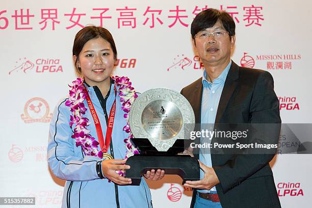 Jin Man of China receives the Leading Amateur Trophy during the Prize giving ceremony of the World Ladies Championship 2016 on 13 March 2016 at...