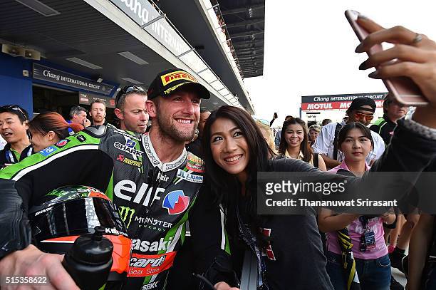 Tom Sykes of Great Britain photos with fan during the Buriram World Superbike Championship on March 13, 2016 in Buri Ram, Thailand.