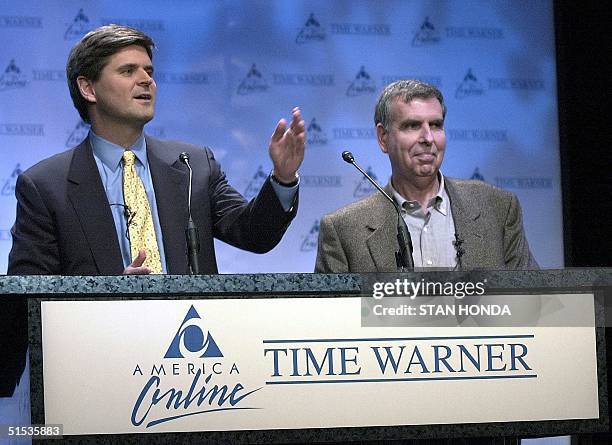 America Online Chairman Steve Case and Time Warner Chairman Gerald Levin announce their companies' merger 10 January 2000 at a New York news...