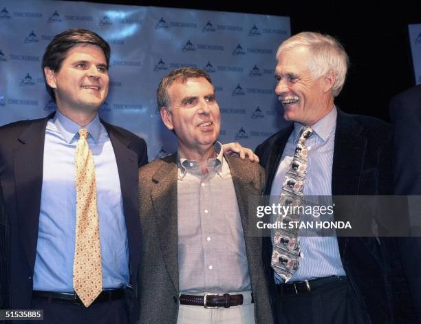 America Online Chairman Steve Case , Time Warner Chairman Gerald Levin and Vice Chairman of Time Warner Ted Turner pose for a photo after they...