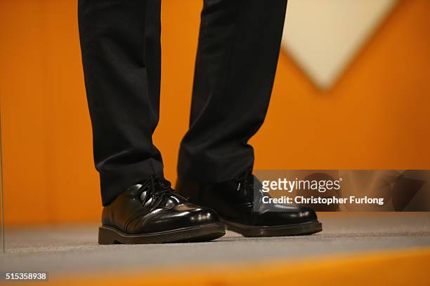 Close-up of Liberal Democrat leader Tim Farron's boots as he delivers his keynote speech to delgates during the Liberal Democrats spring conference...