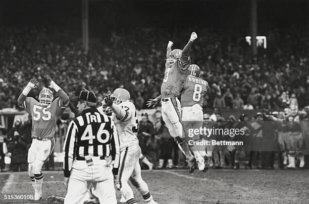 Cleveland, Ohio: Rich Karlis jumps into air as his kick wins the AFC Championship. Ball holder Gary Kubiak jumps with him in victory.