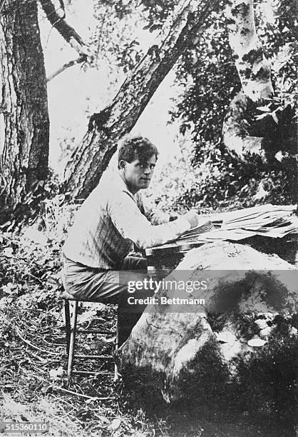 Jack London writing in the outdoors.