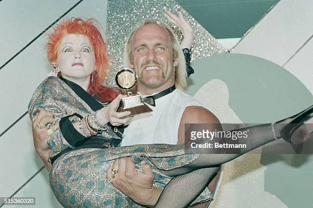 Cyndi Lauper, the outrageous princess of pop, celebrates winning her Grammy Award for best new artist by having her friend, pro-wrestler "Hulk"...