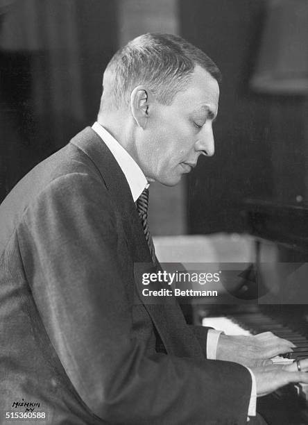 Portrait of Sergei Rachmaninoff , Russian composer, conductor and pianist, posed at a piano. Undated photo, circa 1935.