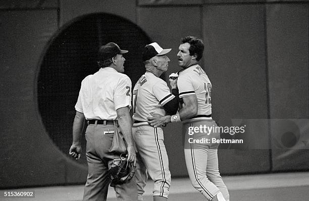 Minneapolis: Baltimore manager Cal Ripken, Sr. Tries to restrain Orioles outfielder Freddie Lynn as he tries to confront plate umpire Nick Bremigan...