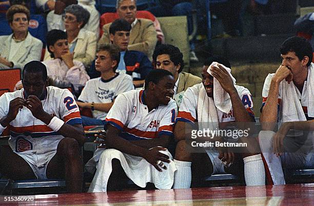 Pontiac, Mich.: Detroit Pistons Isiah Thomas and Adrian Dantley share a happy moment as their game with Boston Celtics comes to an end. The Pistons...