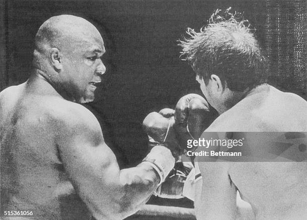 Former World Heavyweight champ George Foreman delivers a hard right to the head of opponent Steve Zouski in the fourth round of their bout at the...