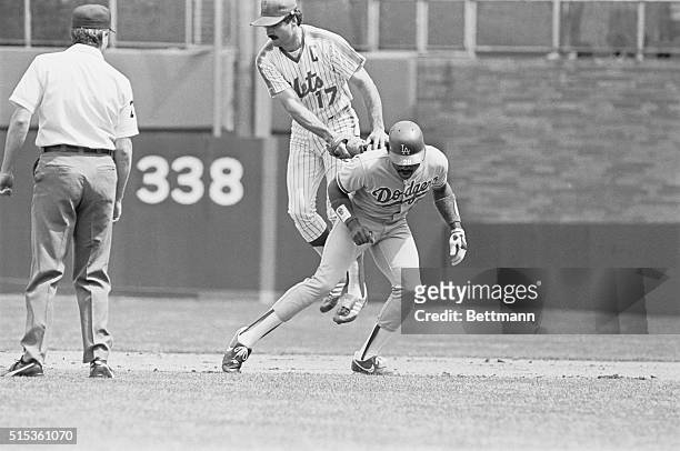 New York: Mets' first baseman Keith Hernandez leaps off the ground to tag Pedro Guerrero in a rundown between first and second base at Shea Stadium....