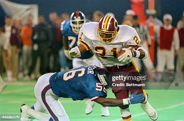 Washington Redskins' Ernest Byner is stopped by the New York Giants' Lawrence Taylor for a four-yard loss late in the first quarter 10/27.