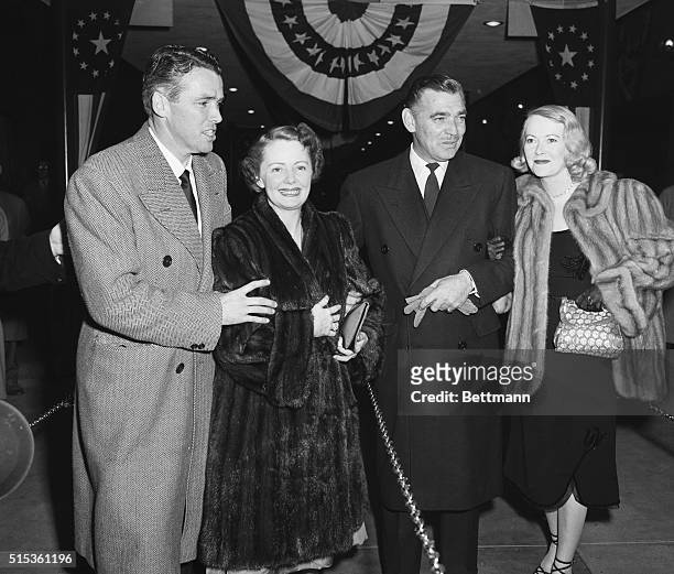 Clark Gable attends the premiere of his new film Key to the City with his wife, Sylvia Ashley, and the film's producer, Z. Wayne Griffin, and his...