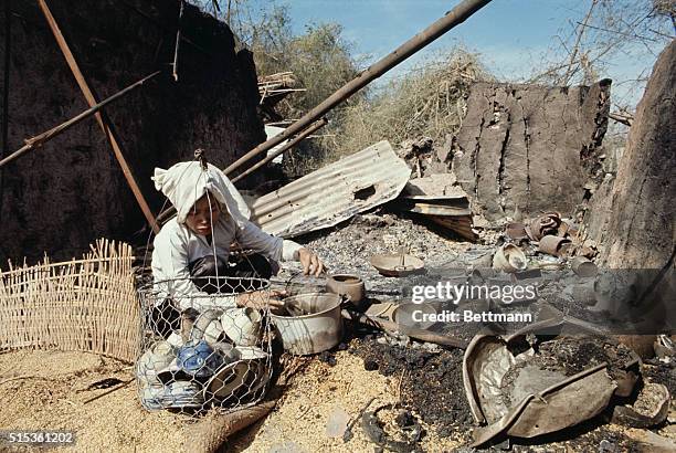 Thanh Phuoc Village, Vietnam: Civilians 50 km northwest of Saigon collecting their belongings after the Viet Cong left their village.