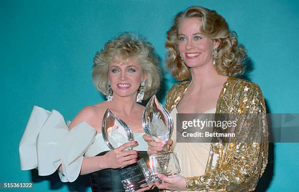 Santa Monica, Calif.: Barbara Mandrell and Cybill Shepherd hold their awards after they tied for top female entertainer honors in the 13th Annual...