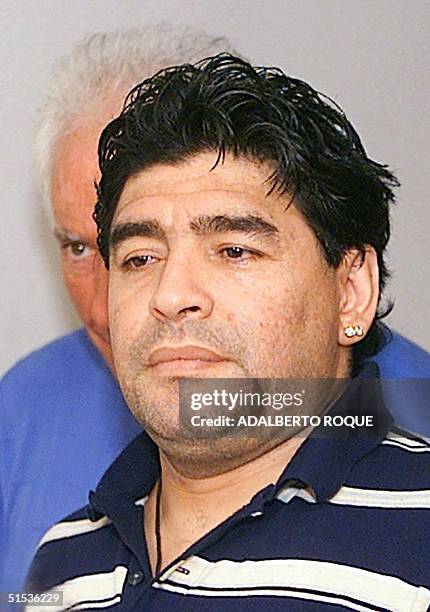 Guiillermo Coppola , agent, speaks to ex-Argentine soccer player Diego Armando Maradona as he arrives at Jose Marti airport in Havana 18 January...