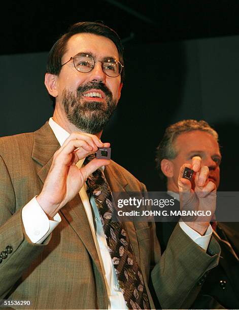 Transmeta Corporation CEO David R. Ditzel holds the new "Crusoe" smart microprocessor 19 January, 2000 in Saratoga, California which is based on...