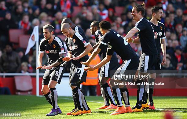 Adlene Guedioura of Watford celebrates with team mates as he scores their second goal during the Emirates FA Cup sixth round match between Arsenal...