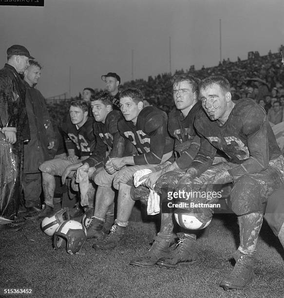 New York, NY- With the sky darkening rapidly behind them, five Cornell players, all covered with mud, stare helplessy out at the field as they watch...
