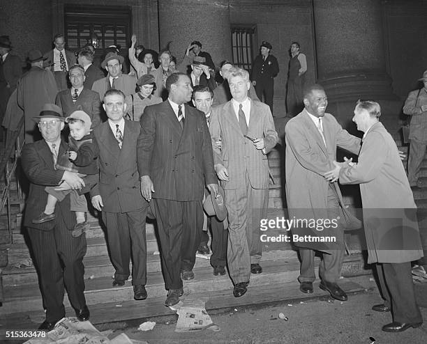 Coming down the steps of Federal Court Nov. 3, after they were released on $260,000 bail, are the convicted leaders of the U.S. Communist Party. The...