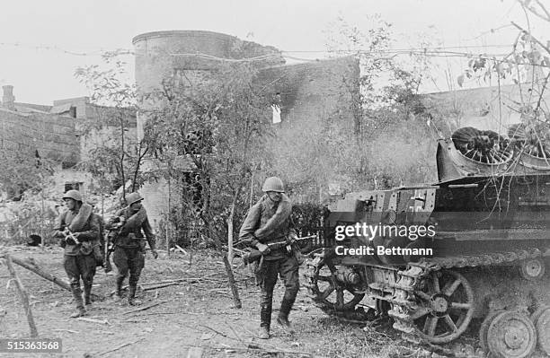 Stalingrad's Defenders Take Over a Nazi Tank. Stalingrad, Russia: Red Army men fighting in the streets of Stalingrad came upon and captured this...