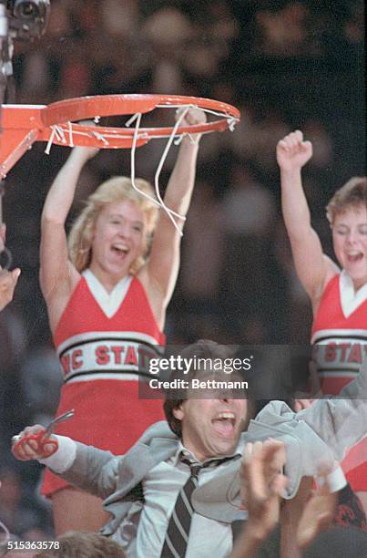 Landover, Md.: North Carolina State head coach Jim Valvano exults after cutting down the net following his team's 68-67 win over North Carolina in...