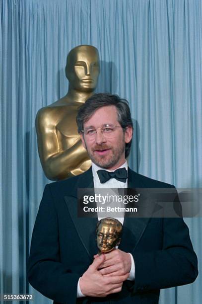 Los Angeles, Ca.: Stephen Spielberg shows off the Oscar given him as recipient of the Irving Thalberg Award.