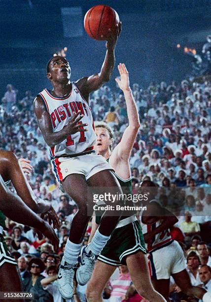 Pontiac, Mich.: Detroit Pistons' Isiah Thomas looks more like a bird than Larry Bird of the Boston Celtics during the third quarter of their game....