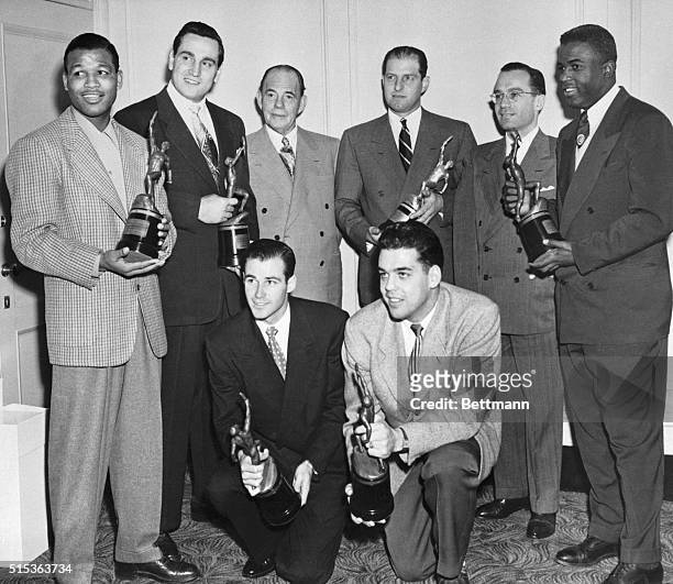 Chosen as tops in their respective fields, these athletes pose with their trophies awarded by "Sport" magazine at a banquet at the Hotel Astor, Jan....