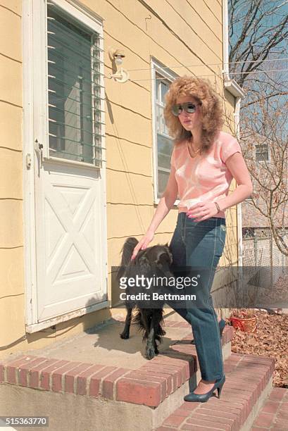 West Babylon: Jessica Hahn who admitted having a sexual encounter with PTL founder Jim Bakker, who has resigned his ministry, enters her home here....