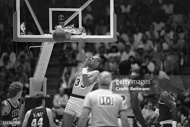 Inglewood, CA- Los Angeles Laker, Kareem Abdul-Jabbar, stuffs one for 2 points during the 1st quarter action.