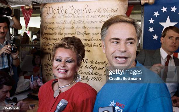 Gatlinburg, Tenn: Jim Bakker, founder of the PTL television ministry and his wife Tammy Faye stand in front of a replica of the Constitution after...