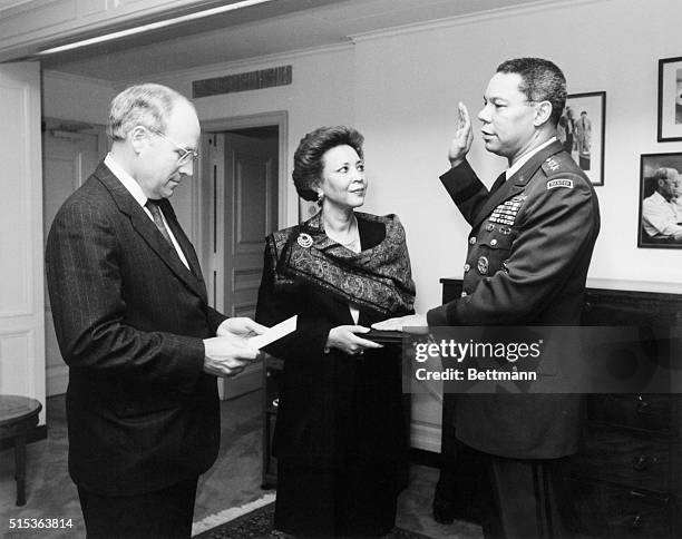 Secretary of Defense Dick Cheney administers the oath of office to General Colin Powell as the Chairman of the Joint Chiefs of Staff. General...