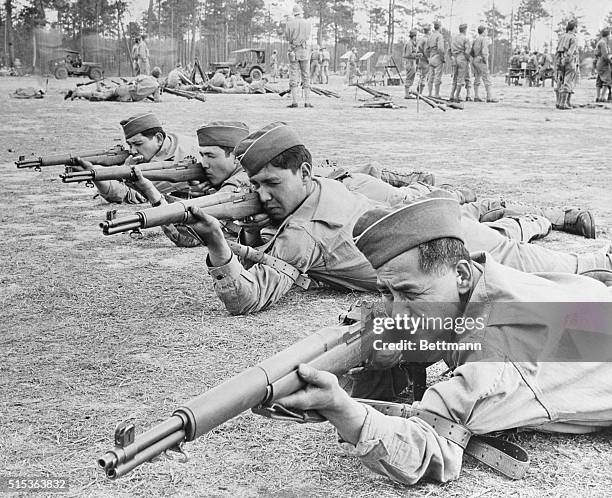 Mexican-American Platoon in Action. Fort Benning, Georgia: U. S. Army soldiers whose forefathers were experts in machete fighting show what they can...