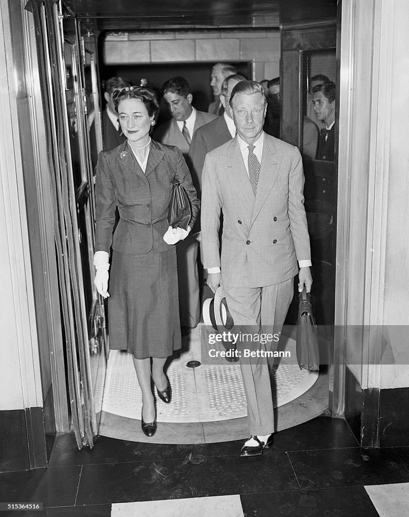 British Officials Entering Through Lobby of Hotel