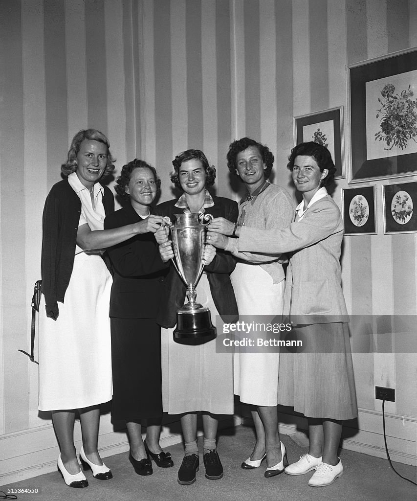 Women's Golf Champions with Trophy
